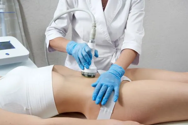 woman having HIFU treatment on her stomach to combat loose skin Broxburn following weight loss